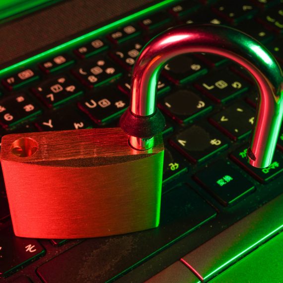 Red padlock on keyboard representing WordPress malware protection
