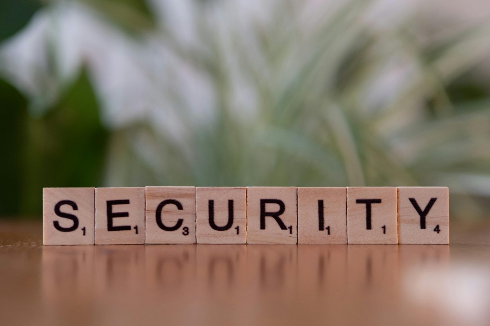 Scrabble tiles spelling Security representing WordPress vulnerability patches